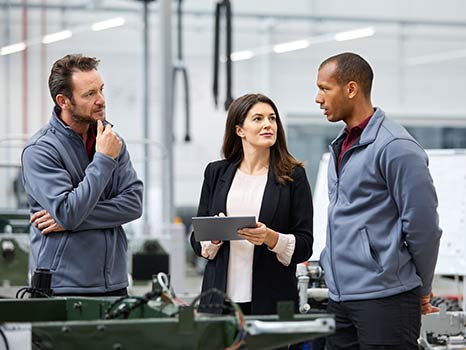 colleagues in a manufacturing facility